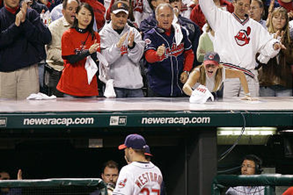 Fans cheer Cleveland Indians pitcher Jake Westbrook (37) as he leaves the game in the seventh inning of Game 3 of the ALCS against the Boston Red Sox Monday in Cleveland. The Indians won 4-2 to lead the series two games to one.