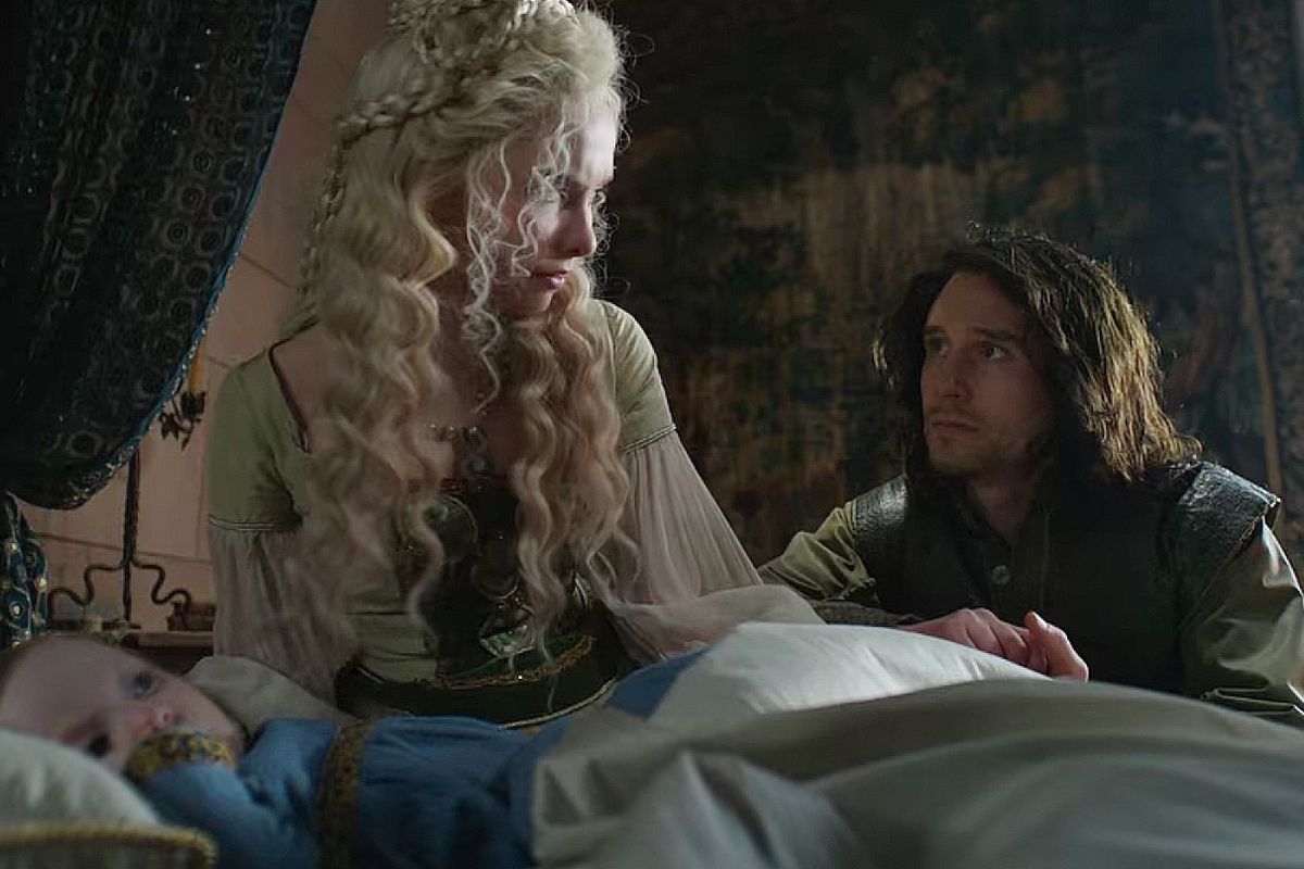 Duny pleads on his knees with Pavetta as she sits in bed with a baby Ciri in The Witcher season two