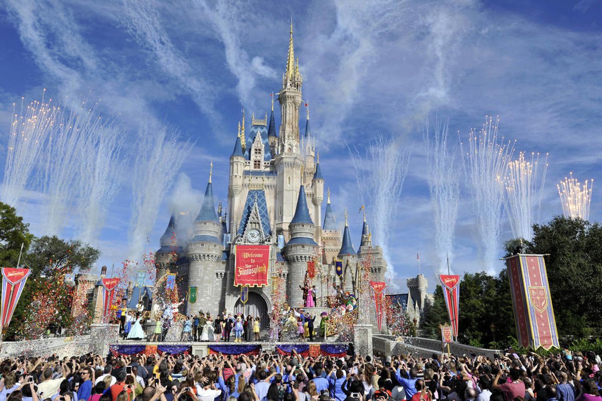 This image released by Disney shows fireworks punctuating the sky at the grand opening celebration at the Cinderella Castle for the New Fantasyland attraction at the Walt Disney World Resort’s Magic Kingdom theme park in Lake Buena Vista, Fla., Thursday,