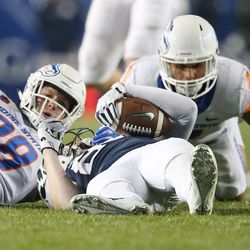 Brigham Young Cougars tight end Matt Bushman (89) is upended by Boise State players in Provo on Friday, Oct. 6, 2017.
