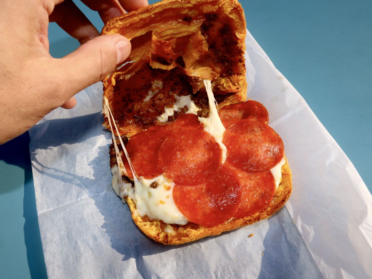 A beef patty with pepperoni and mozzarella cheese.