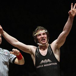 Maple Mountain's Britain Carter celebrates his win in the 4A 120-pound match during the 5A/4A wrestling championships at UVU in Orem on Feb. 14, 2013.