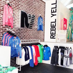 Rebel Yell's vibrant loungewear hangs from racks and walls. Basic shirts range from $50 to $70, hoodies are a bit over $100 and sweat pants range from $88 to $90.