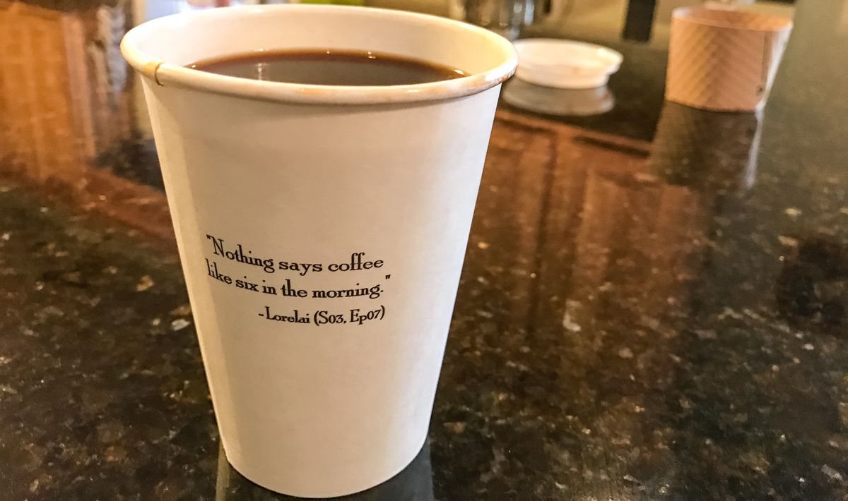 A Luke's Diner to-go cup from JavaVino, with a quote from Lorelai Gilmore: "Nothing says coffee like six in the morning."
