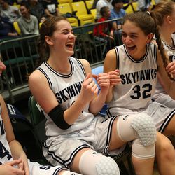 Salem Hills's Kaylee Brimhall, Hailey Johnson and Sydney Sorensen celebrate their team's likely win in the last minutes of the 4A championship girls basketball game against Salem Hills at the Utah Community Credit Union Center in Orem on Saturday, March 3, 2018. Salem Hills won 57-35.