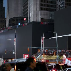 Screens in Times Square are black during a widespread power outage, Saturday, July 13, 2019, in New York. Authorities say a transformer fire caused a power outage in Manhattan and left businesses without electricity, elevators stuck and subway cars stalled.  (AP Photo/Michael Owens)
