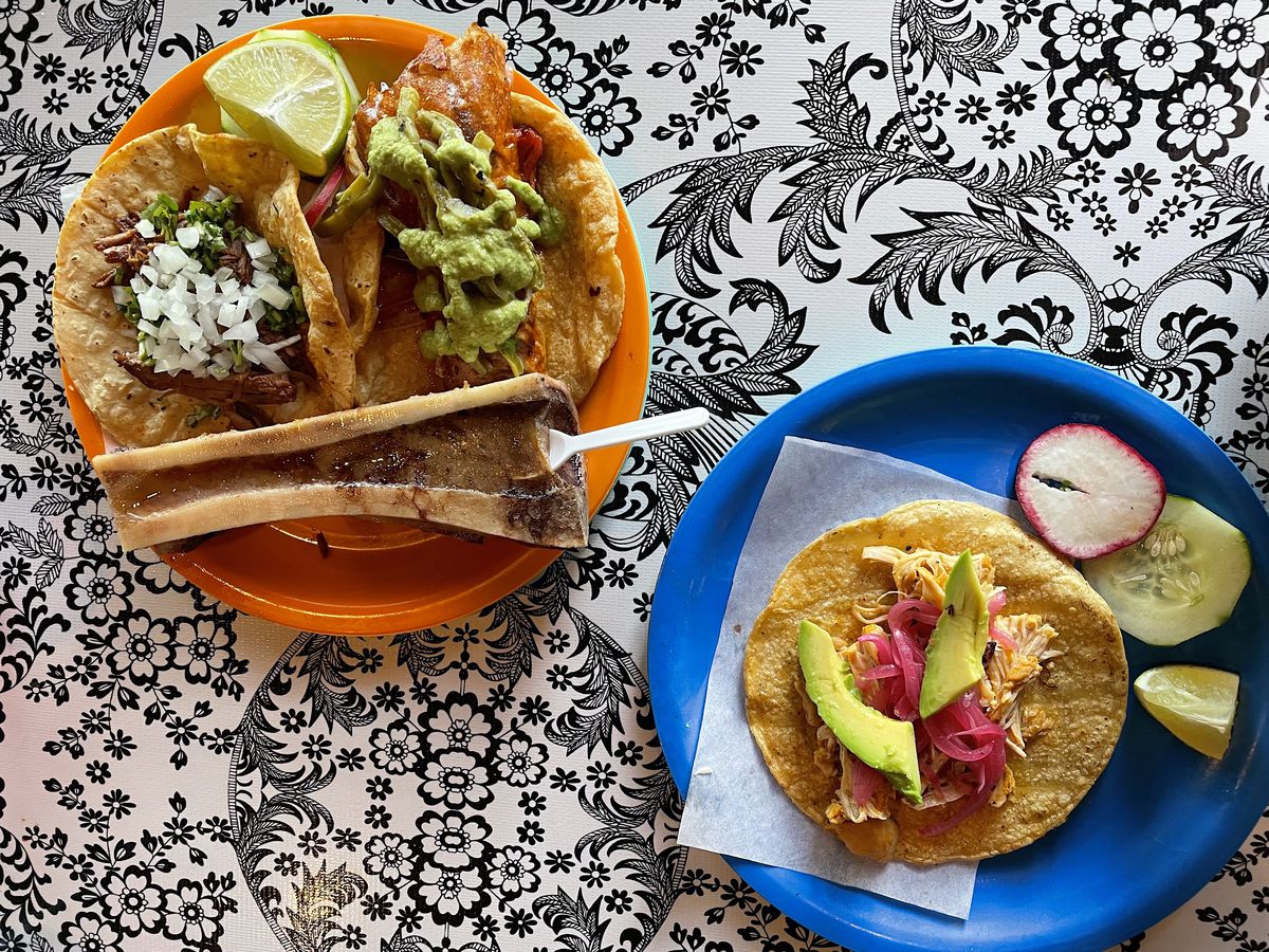 Birria taco with bone marrow, pork chop taco with cactus, and pollo pibil with avocado. 