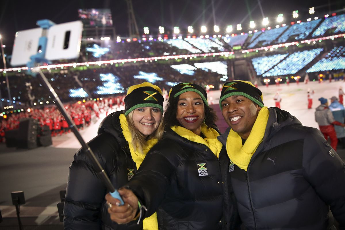 Athletes from Jamaica's delegation take a selfie as they parade during the opening ceremony of the Pyeongchang 2018 Winter Olympic Games at the Pyeongchang Stadium on February 9, 2018.