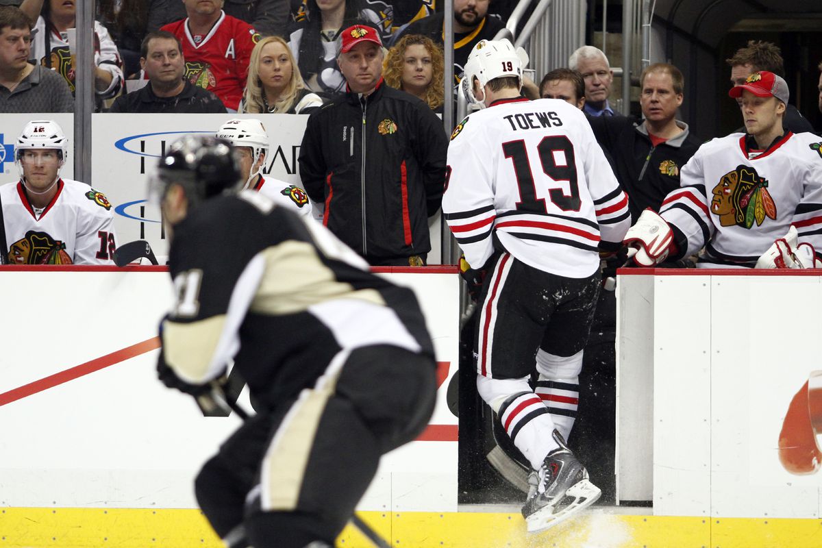 Toews leaves the game after injuring his arm from a Brooks Orpik check.