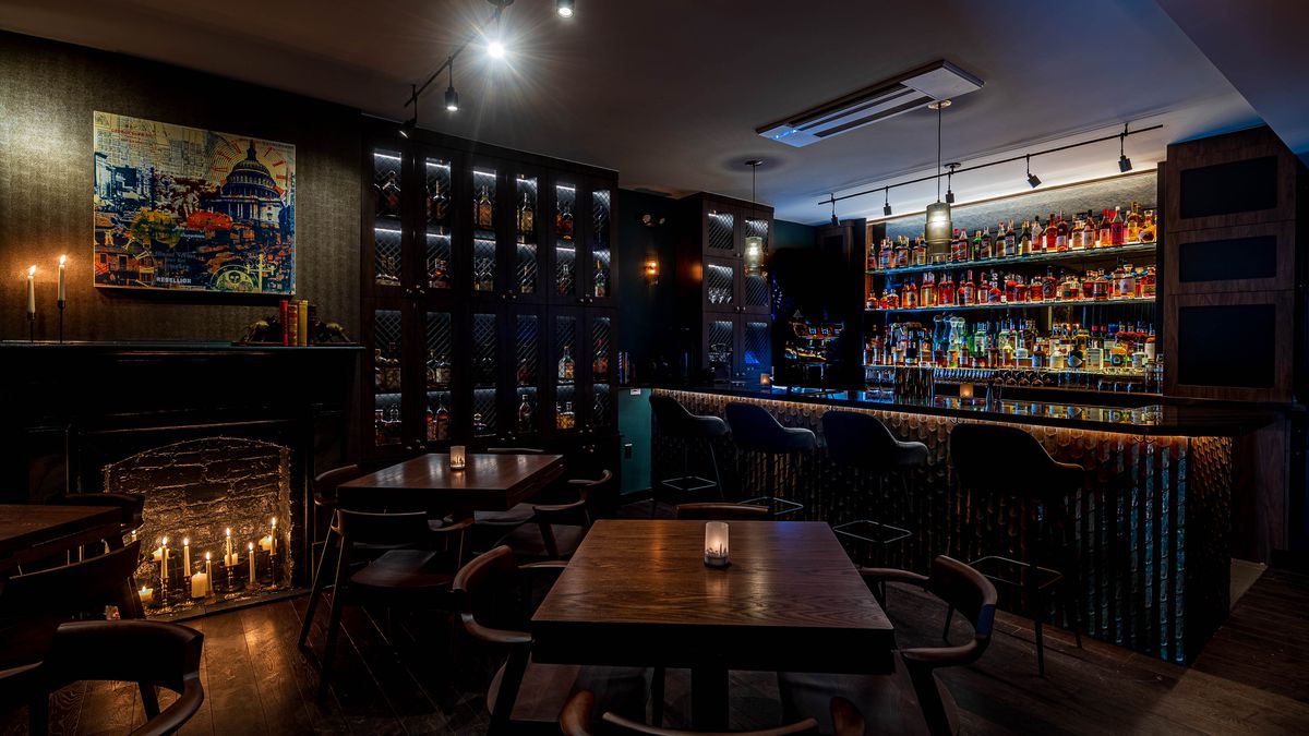 A glowing bar lined with lockers and spirits