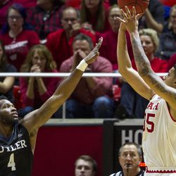 Utah forward Kyle Kuzma (35) shoots over Butler forward Tyler Wideman (4) during an NCAA college basketball game at the Huntsman Center in Salt Lake City on Monday, Nov. 28, 2016. Butler took down Utah 68-59 to remain undefeated.
