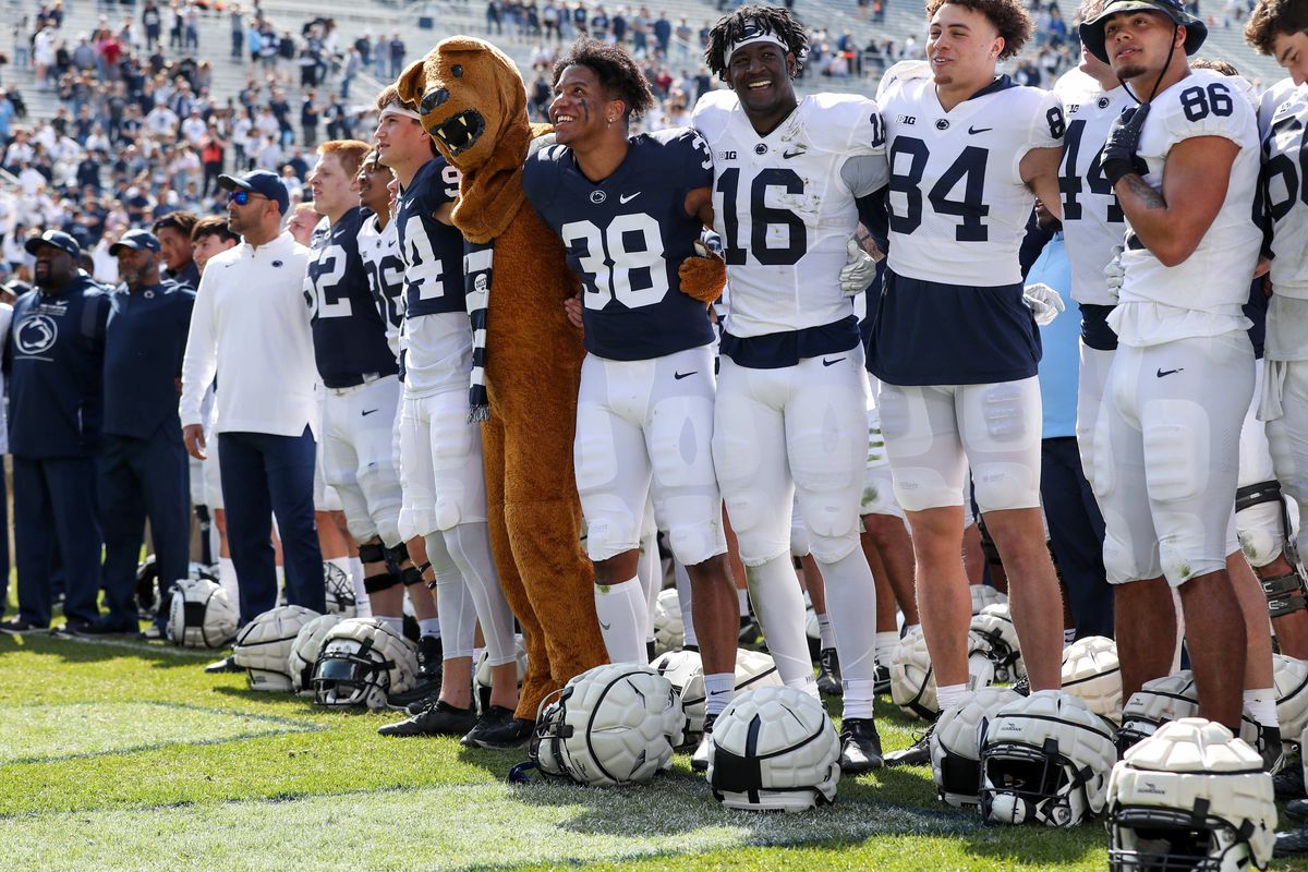 Apr 23, 2022; University Park, Pennsylvania, USA; Penn State Nittany Lion players sing their alma mater following the conclusion of the Blue White spring game at Beaver Stadium. The defense defeated the offense 17-13.