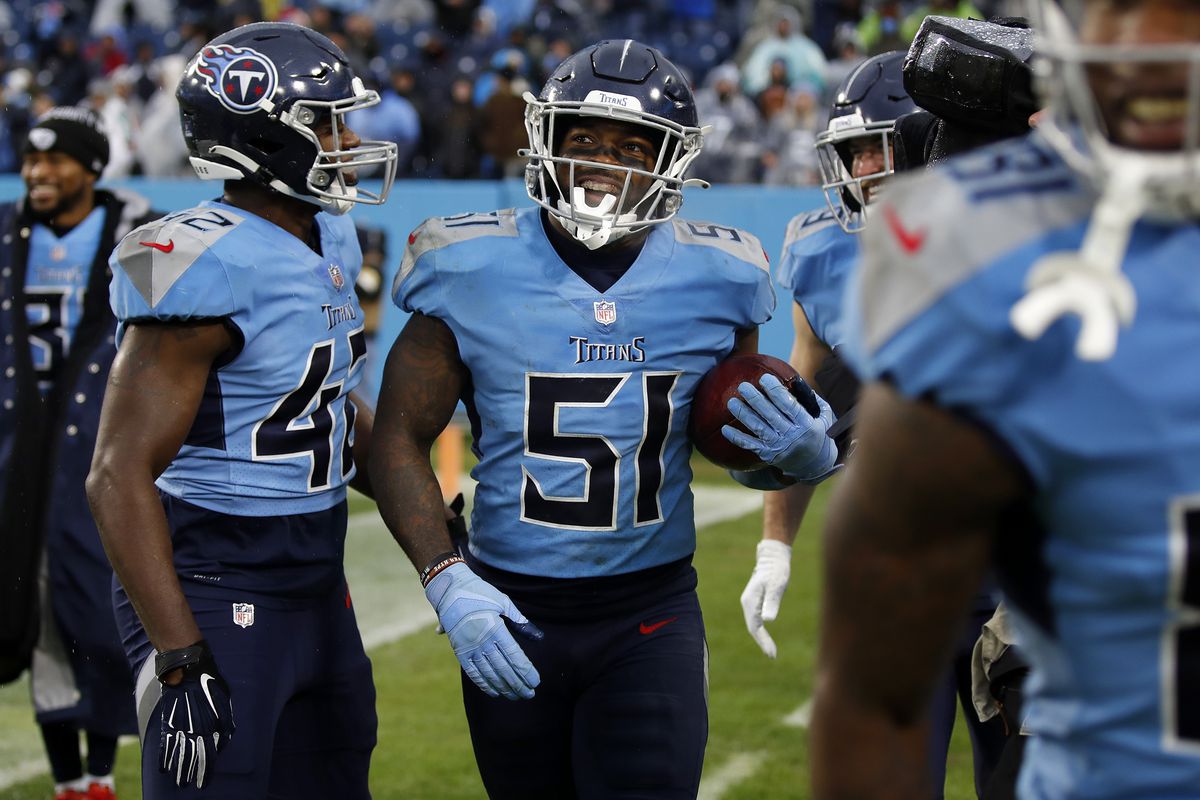 David Long #51 of the Tennessee Titans celebrates with Joe Jones #42 after making an interception during the fourth quarter against the Miami Dolphins at Nissan Stadium on January 02, 2022 in Nashville, Tennessee.
