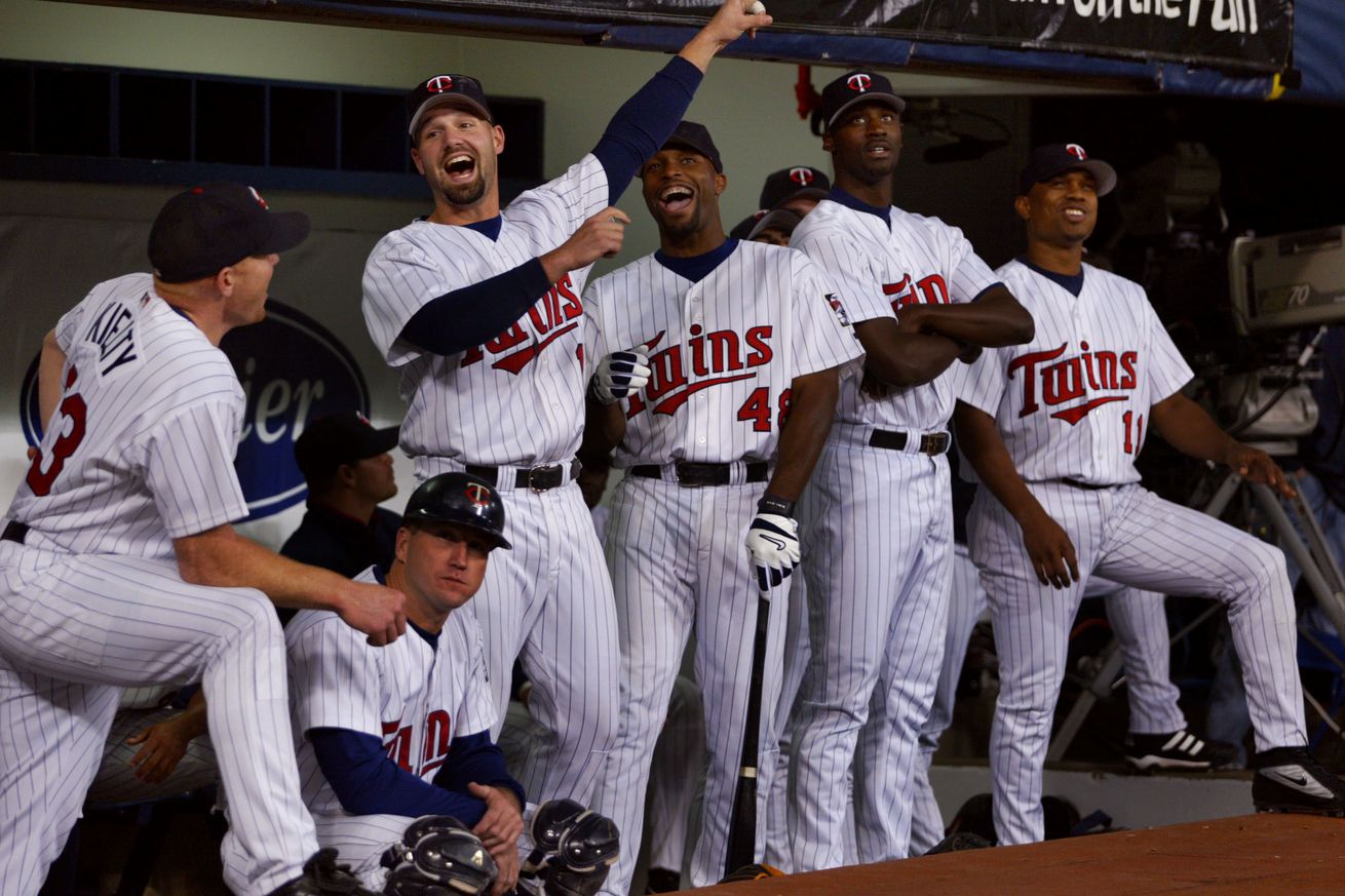 Minneapolis MN, 9/24/02 Twins celebrate Championship----Twins players left to right Bobby Kielty,Tom Prince, Dustan Mohr, Torii Hunter, LaTroy Hawkins, and Jacque Jones watch a video of their 2002 season before their central divison championship banner is