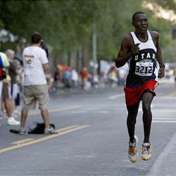 Cyprus High's Jamal Tongo heads for the finish line of the Deseret News 10K Saturday.
