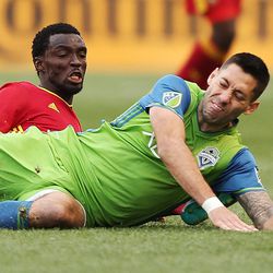 Real Salt Lake midfielder Stephen Sunny Sunday (8) and Seattle Sounders midfielder Clint Dempsey (2) tumble in Sandy on Saturday, March 12, 2016. Real won 2-1. 