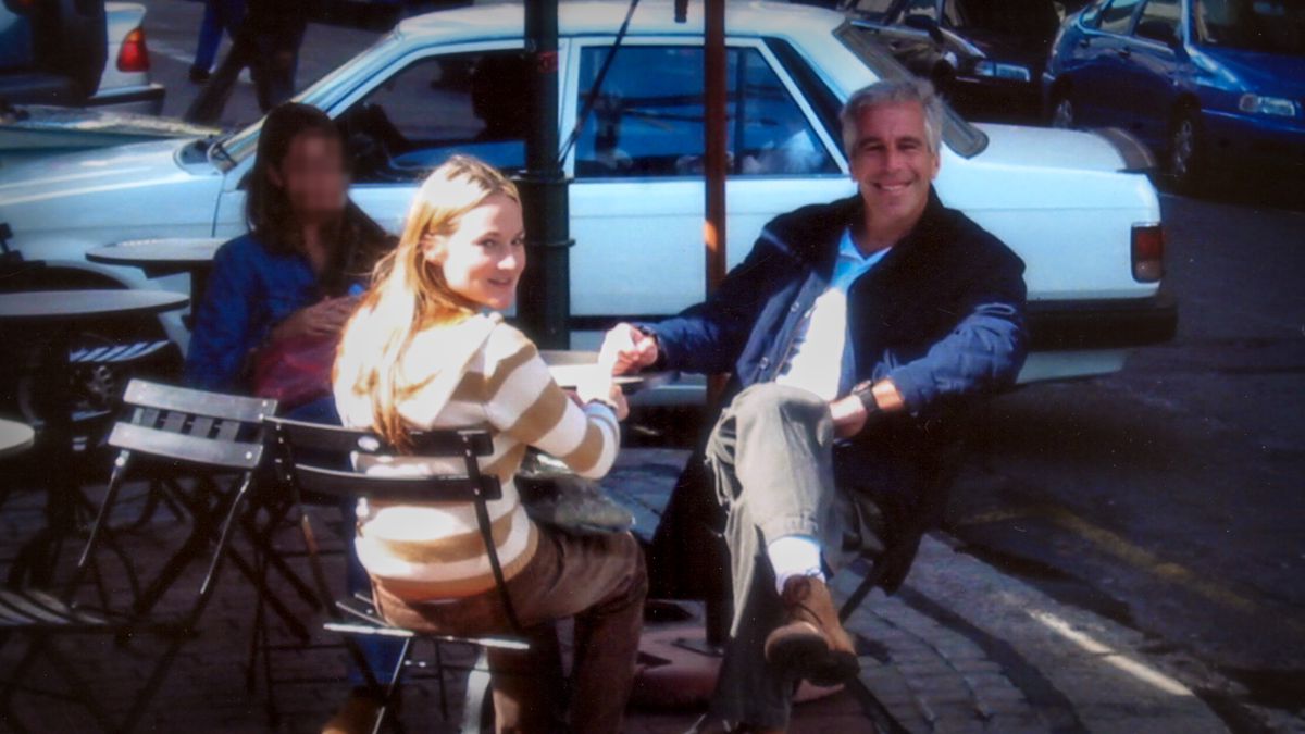 Jeffrey Epstein, the absolute worst, sits with a young woman, Chauntae Davies, at a table