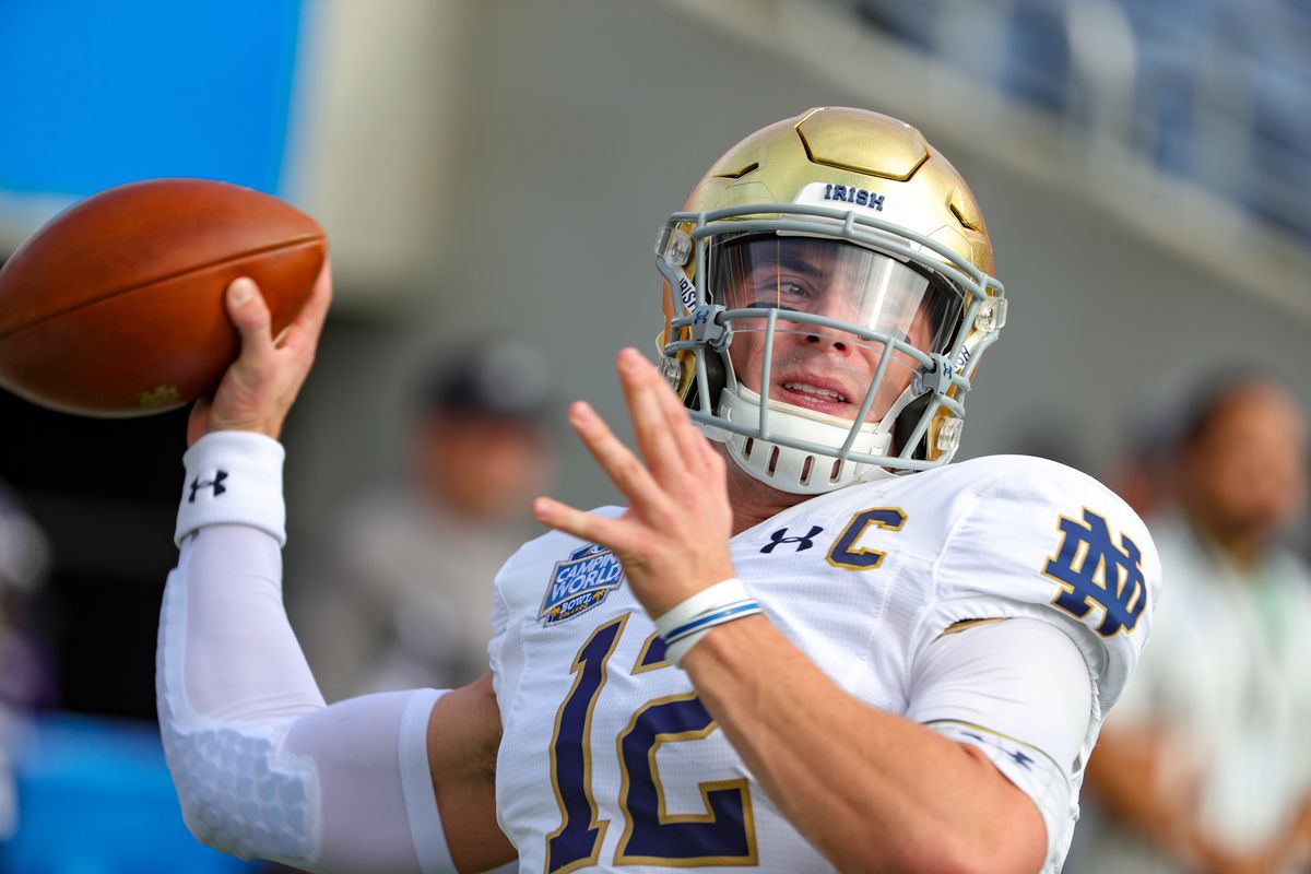Notre Dame Fighting Irish quarterback Ian Book warms up before the Camping World Bowl between Notre Dame and Iowa State on December 28, 2019, at Camping World Stadium in Orlando FL.