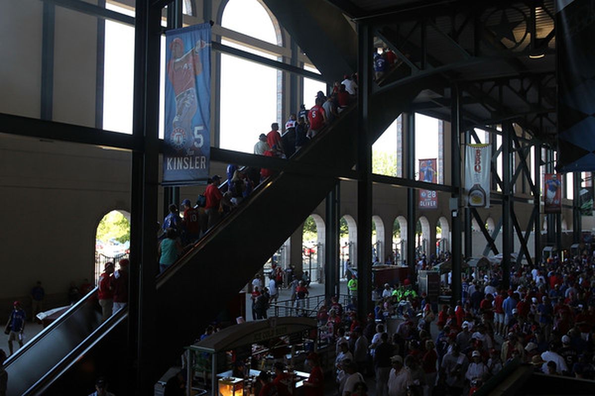 ARLINGTON, TX - OCTOBER 10:  Fans enter Rangers Ballpark in Arlington before game 4 of the ALDS between the Tampa Bay Rays and the Texas Rangers on October 10, 2010 in Arlington, Texas.  (Photo by Ronald Martinez/Getty Images)