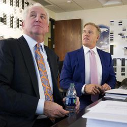 In this photo provided by the Denver Broncos, Broncos vice president John Elway, right, and head coach John Fox watch a broadcast of the NFL football draft in the war room at the team's headquarters in Englewood, Colo., on Thursday, April 25, 2013. Denver has the 28th overall pick the in draft. 