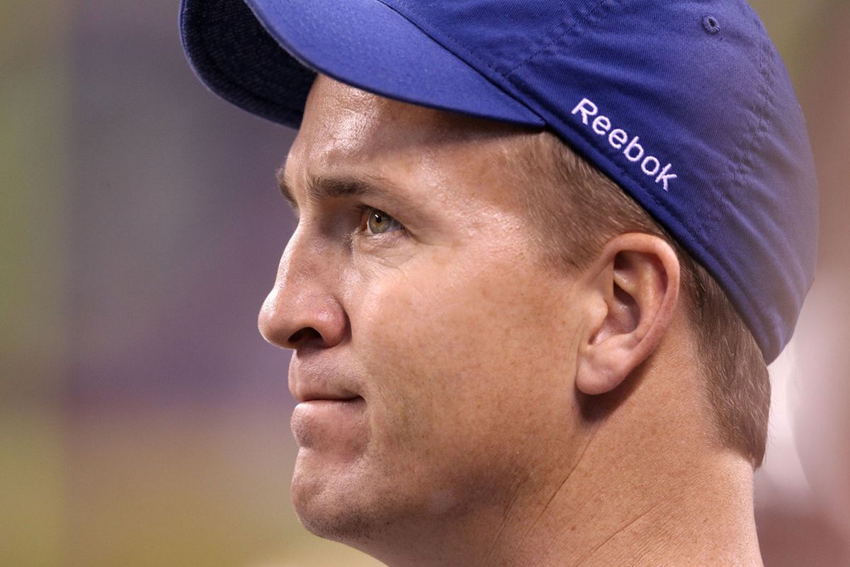 INDIANAPOLIS, IN - NOVEMBER 27:  Peyton Manning of the Indianapolis Colts watches the action during the game against the Carolina Panthers at Lucas Oil Stadium on November 27, 2011 in Indianapolis, Indiana.  (Photo by Andy Lyons/Getty Images)