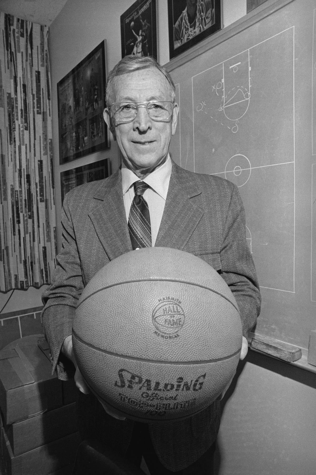 John Wooden Holding a Basketball
