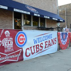 3:54 p.m. Banners still out along the patio at Bernie's Bar & Grill - 