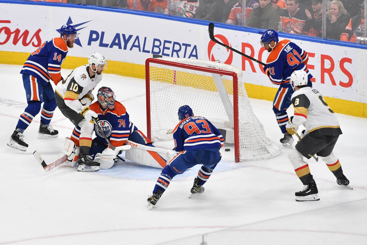 Nicolas Roy #10 of the Vegas Golden Knights scores the winning goal against Stuart Skinner #74 of the Edmonton Oilers in overtime on March 25, 2023 at Rogers Place in Edmonton, Alberta, Canada.