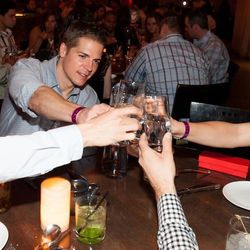 Jason Kennedy toasts with Whole World water at Tao Asian Bistro. Photo: Brenton Ho/Powers Imagery