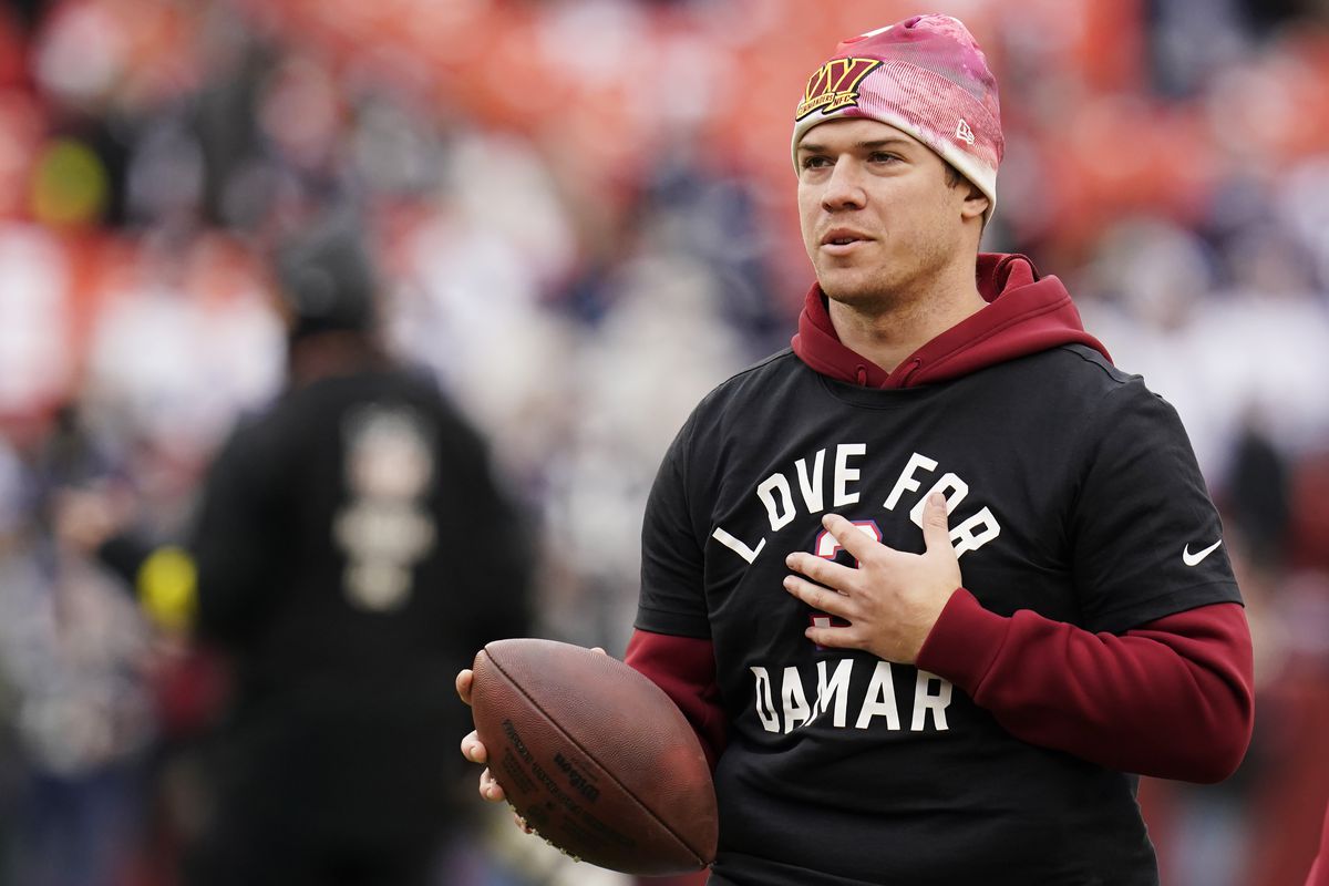 Quarterback Taylor Heinicke #4 of the Washington Commanders warms up prior tot he game against the Dallas Cowboys at FedExField on January 08, 2023 in Landover, Maryland.