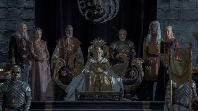 The royal family in House of the Dragon, gathered around Jaehaerys on the throne
