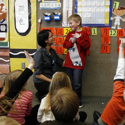 Tanner Isom listens to first-grade teacher Yu-Pei Tan during Chinese immersion class at Lone Peak Elementary School. 