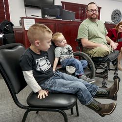 Jennie Taylor, widow of North Ogden Mayor Maj. Brent Taylor,  right, talks with Army Sgt. 1st Class Travis Vendela, and two of his children, Kaiden, 3, and Trayden, 4, during a press conference held by the Stephen Siller Tunnel to Towers Foundation at the North Ogden Municipal Building on Thursday, Jan. 3, 2019. The foundation paid off Taylor’s mortgage and is building a new home for Vendela, who lost both legs above the knee in Iraq in 2007.