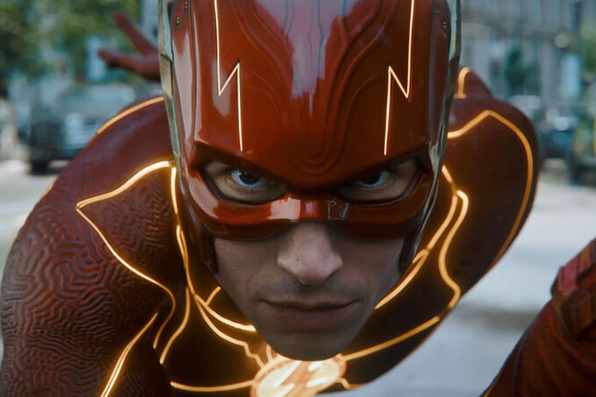 Ezra Miller mid-running motion in suit as The Flash.