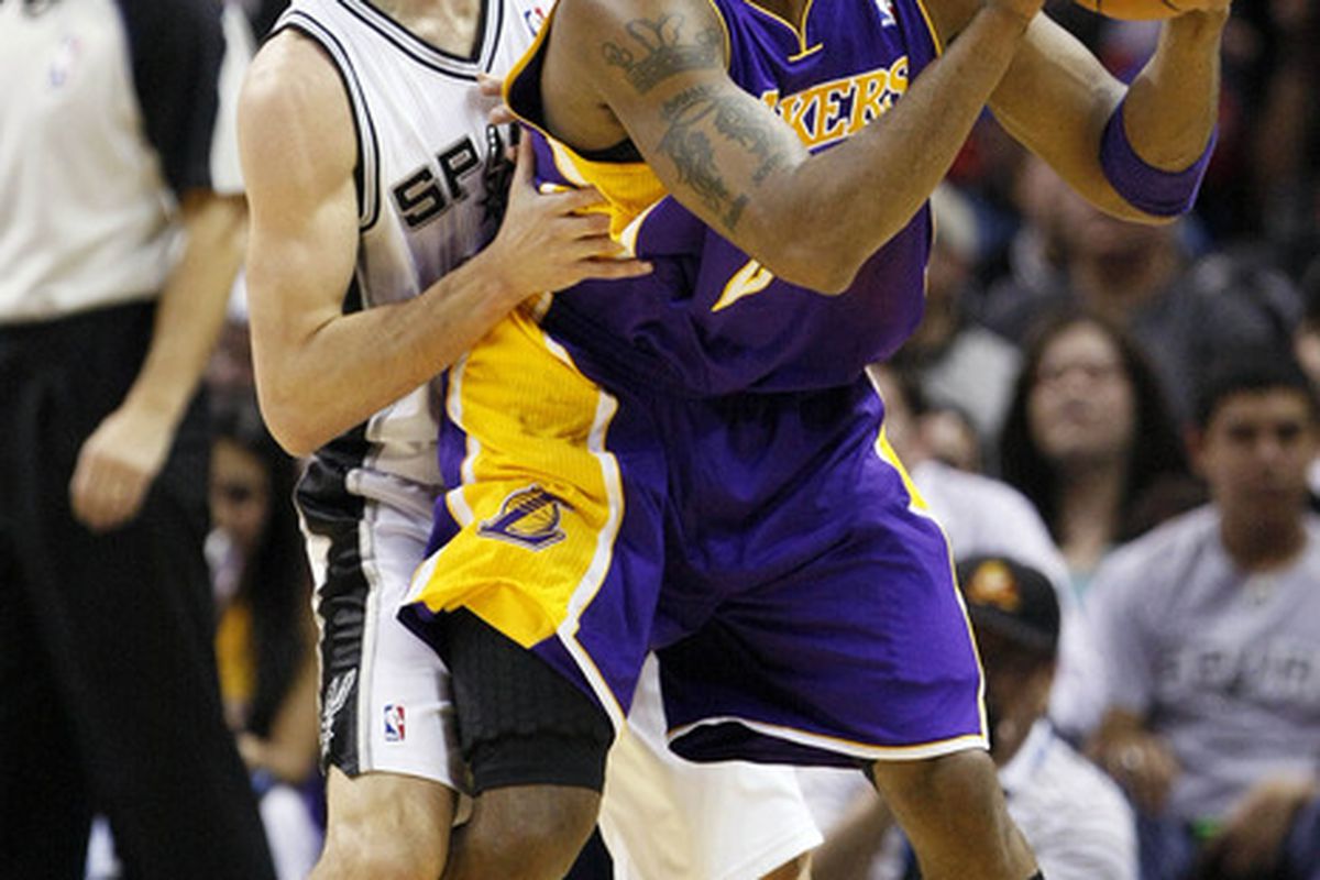 Apr 20, 2012; San Antonio, TX, USA; Los Angeles Lakers guard Kobe Bryant (front) is defended by San Antonio Spurs guard Manu Ginobili (behind) during the first half at the AT&T Center. Mandatory Credit: Soobum Im-US PRESSWIRE