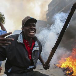 Residents of the Mathare area of Nairobi, Kenya, take to the streets by blocking roads with burning tyres to protest in support of Kenyan opposition leader and presidential candidate Raila Odinga, Wednesday Aug. 9, 2017. Odinga alleges that hackers manipulated the Tuesday election results which appear to show President Uhuru Kenyatta has a wide lead over Odinga. (AP Photo. (AP Photo/Brian Inganga)