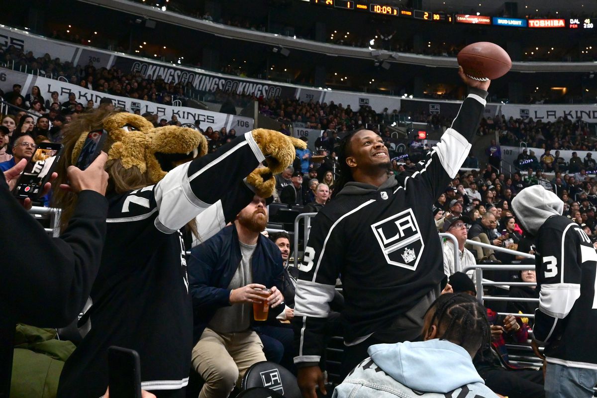 Jan 8, 2020; Los Angeles, California, USA; Los Angeles Rams running back Todd Gurley (right) poses wtih Los Angeles Kings mascot Bailey during the NHL game against the Dallas Stars at Staples Center. Mandatory Credit: Kirby Lee