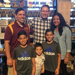 Matthew, Tyler, Logan, Branden and Niky Graffagnino stood in line Thursday night, then because of rain had to come back Saturday to get their books signed by Steve Young.