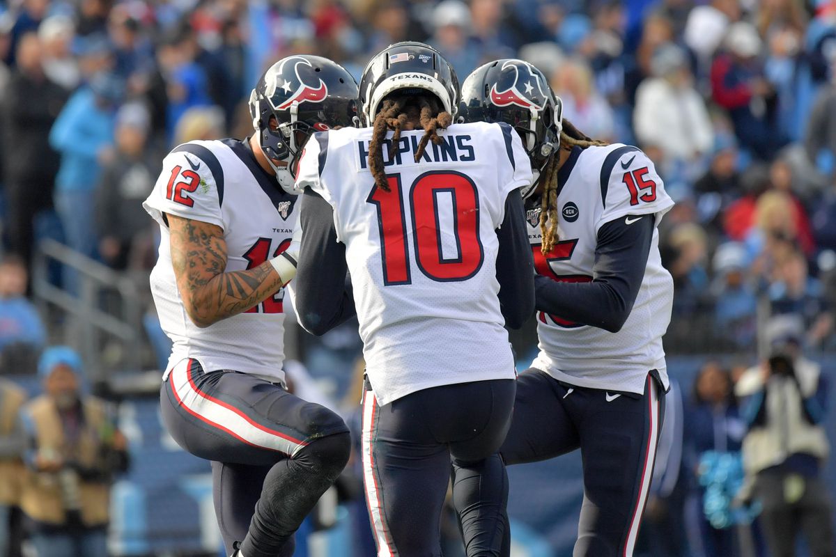 Houston Texans wide receiver Kenny Stills huddles with teammates Houston wide receiver DeAndre Hopkins and Houston wide receiver Will Fuller after catching a touchdown pass against the Tennessee Titans during the first half at Nissan Stadium.