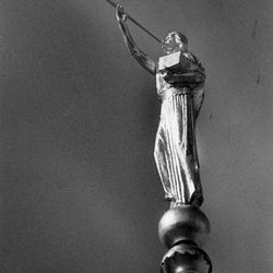 The first view of the Angel Moroni statue atop the Jordan River Temple was to have been seen only after an unveiling ceremony Aug. 15 1981, but strong valley winds Aug. 9-10 tore away the canvas and caused some damage to the gold leafing, which was repaired. The statue was not redraped.
