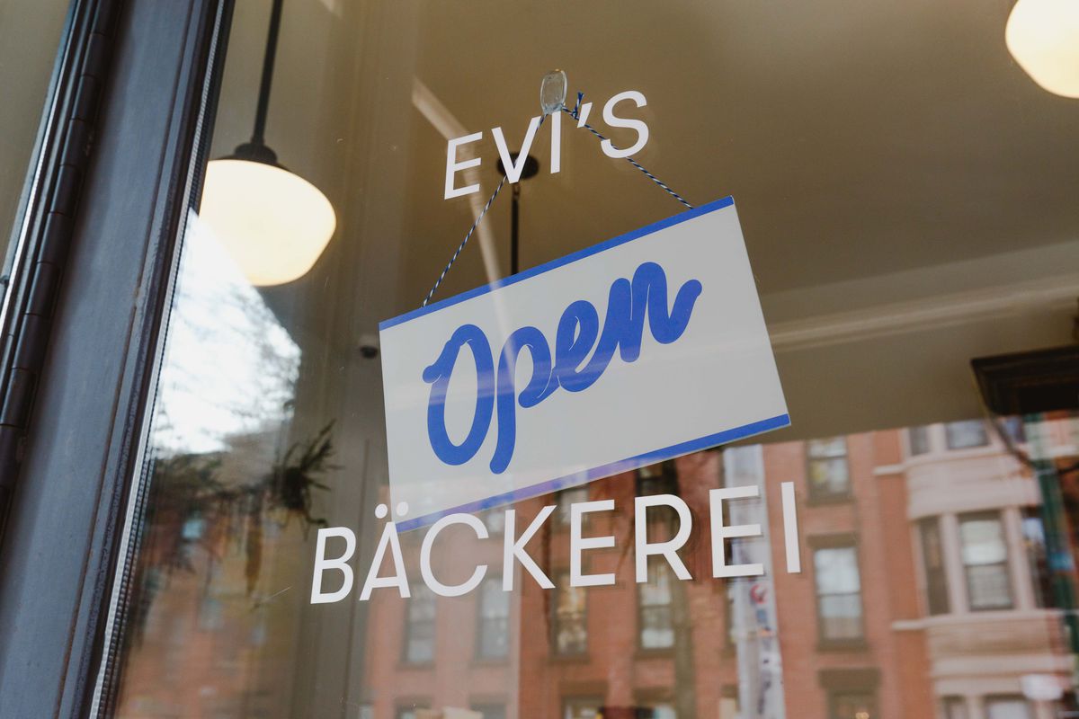 An “open” sign hangs from the front window at Evi’s Bakeri in Prospect Heights.