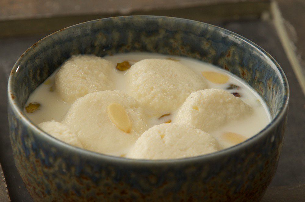 A bowl of ras malai, an Indian dessert made of cheese, milk, and almonds, at Rajbhog
