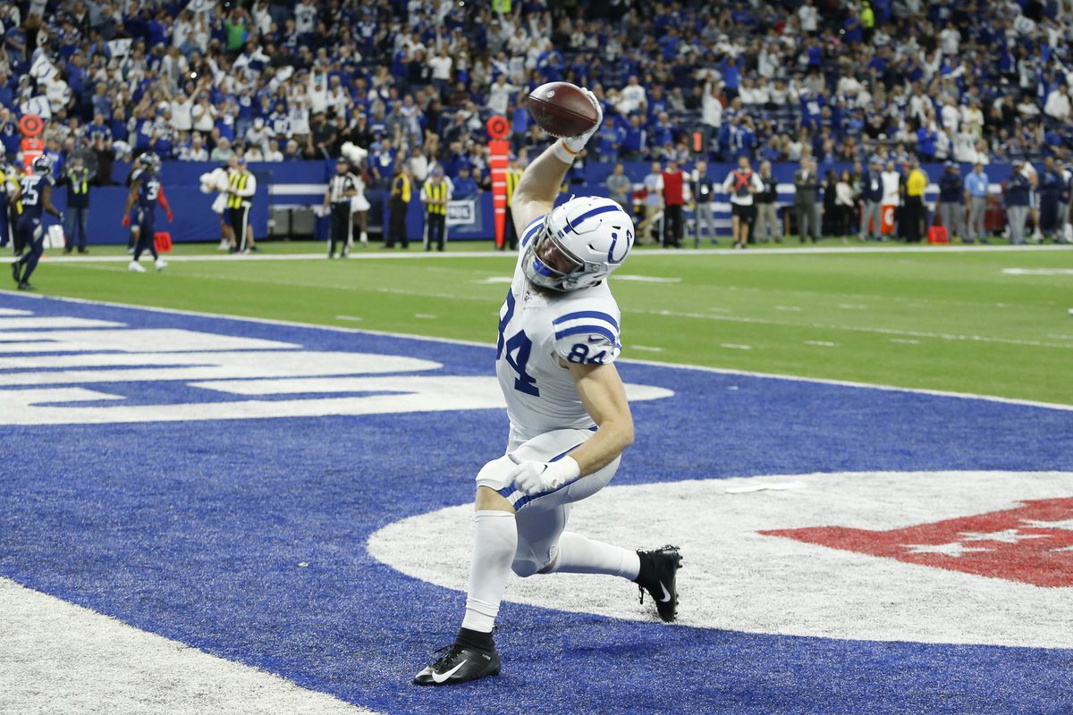 Indianapolis Colts tight end Jack Doyle spikes the ball after scoring a touchdown against the Tennessee Titans during the first quarter at Lucas Oil Stadium.