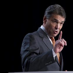 Republican presidential hopeful Gov. Rick Perry of Texas gestures during a speech at the Values Voter Summit on Friday, Oct. 7, 2011, in Washington.