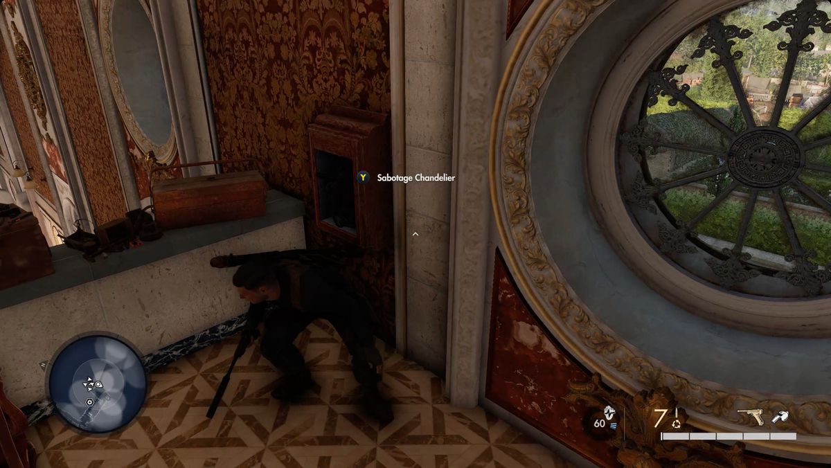Sniper Elite 5 player standing on the ballroom’s balcony next to a panel with a prompt reading “sabotage chandelier.”