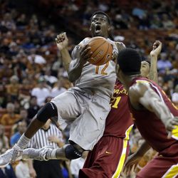 Texas' Myck Kabongo (12) shoots over Iowa State's Will Clyburn (21) and Melvin Ejim, right, during the first half of an NCAA college basketball game, Wednesday, Feb. 13, 2013, in Austin, Texas. The Jazz are interested in Kabongo as a 2013 draft prospect.