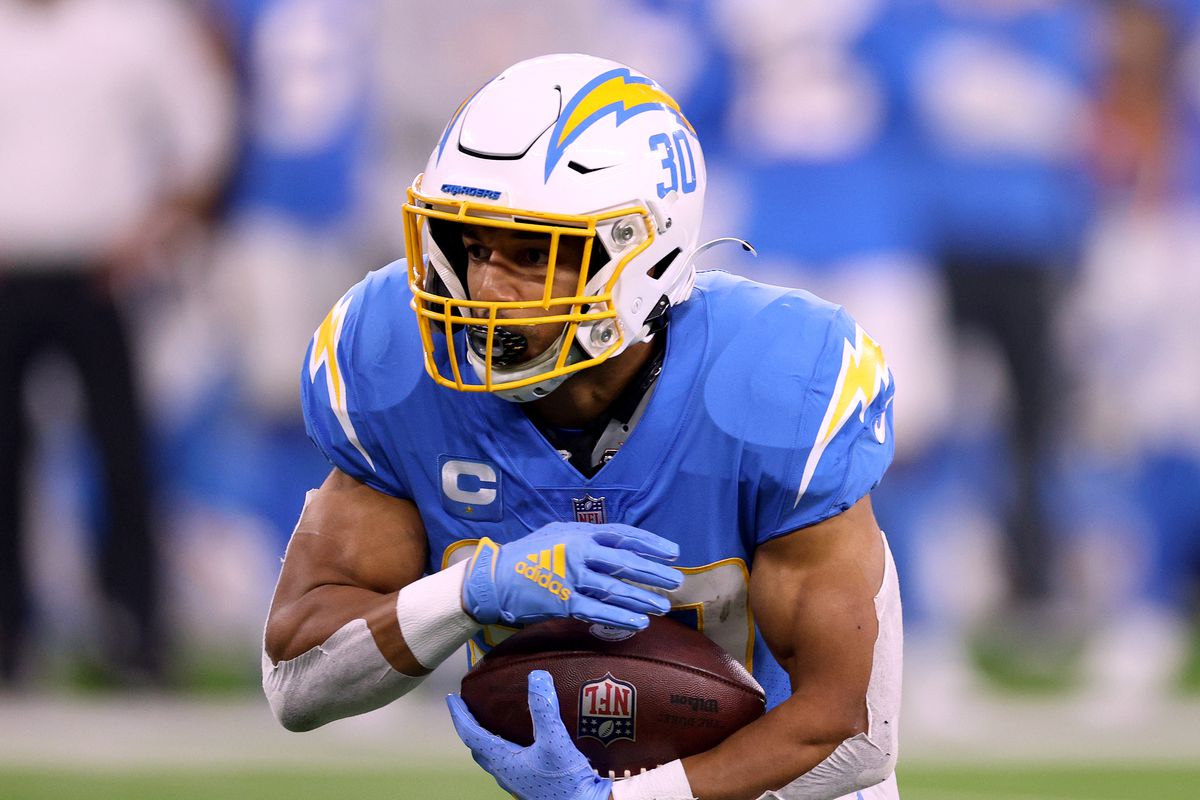 Austin Ekeler #30 of the Los Angeles Chargers runs during a 34-28 loss to the Kansas City Chiefs at SoFi Stadium on December 16, 2021 in Inglewood, California.