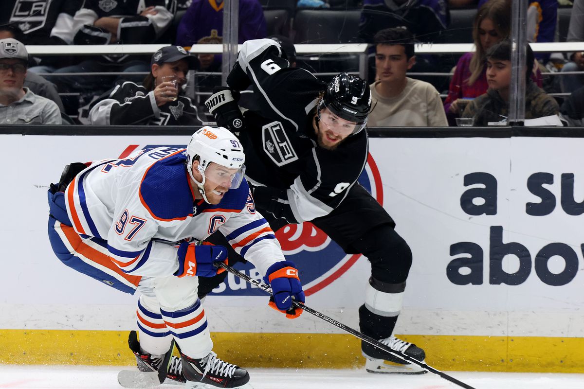 Connor McDavid of the Edmonton Oilers steals the puck from Adrian Kempe of the Los Angeles Kings during the first period in Game Four of the First Round of the 2023 Stanley Cup Playoffs at Crypto.com Arena on April 23, 2023 in Los Angeles, California.
