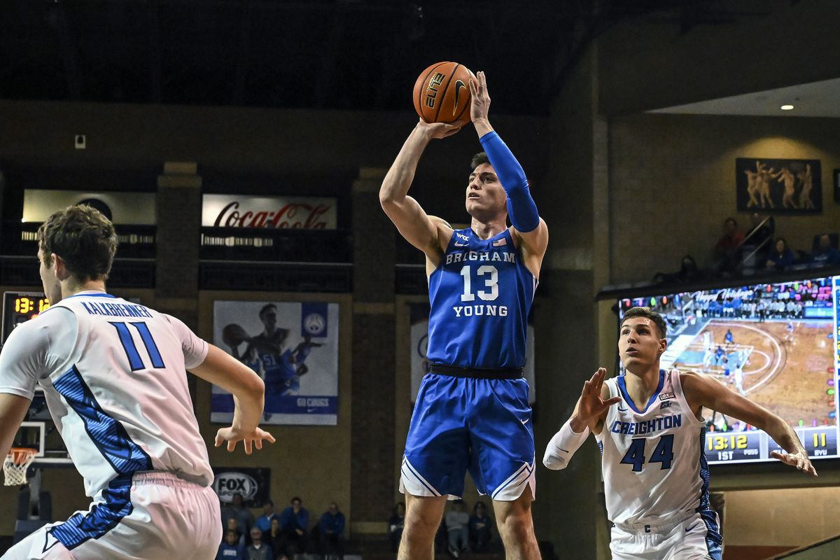 BYU’s Alex Barcello shoots between pair of Creighton players during game&nbsp;in Sioux Falls, S.D., Dec. 11, 2021.