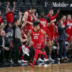 Utah Utes guard Alfonso Plummer (25), center, runs back up the court as the Utah bench celebrates Plummer’s eleventh 3-pointer during their game against the Oregon State Beavers during the first round of the Pac-12 men’s basketball tournament at T-Mobile Arena in Las Vegas on Wednesday, March 11, 2020.